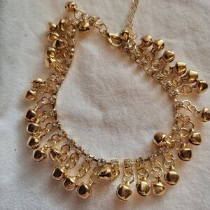 Elegant Gold Charm Bracelet With Dangling Hearts